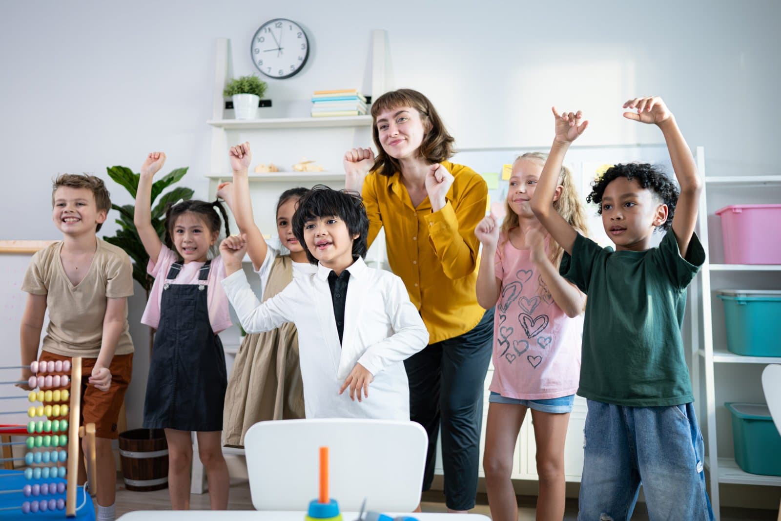 A teacher and kids in a classroom